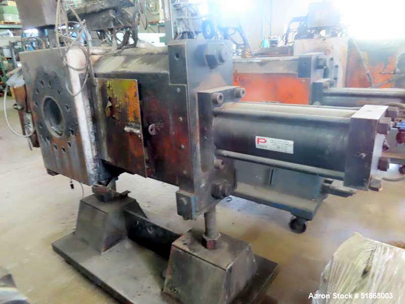 Used MGB Model SC12 Slide Plate Screen Changer. (2) Nominal 12" diameter breaker plates. Unit is mounted on a stand with casters supplying approximately a  42" discharge height. Package includes a 10...