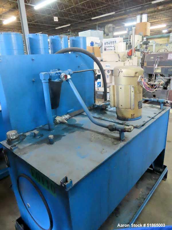 Used MGB Model SC12 Slide Plate Screen Changer. (2) Nominal 12" diameter breaker plates. Unit is mounted on a stand with casters supplying approximately a  42" discharge height. Package includes a 10...