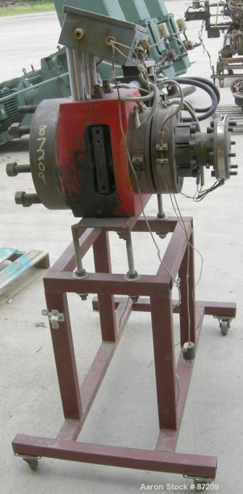 USED: MGB 4.5" hydraulic screen changer. No power pack. Mounted on a frame.