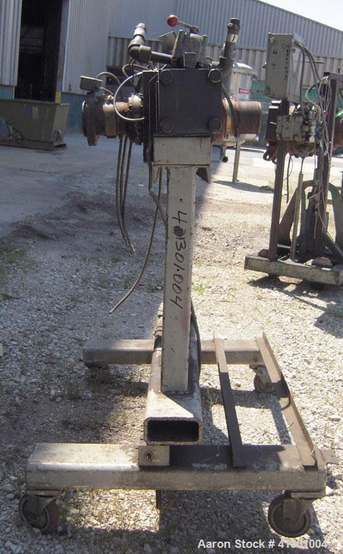 Used Approximate 3" Hydraulic Screen Changer.  Mounted on a carbon steel frame with casters.  Requires a screen holder and power pack.