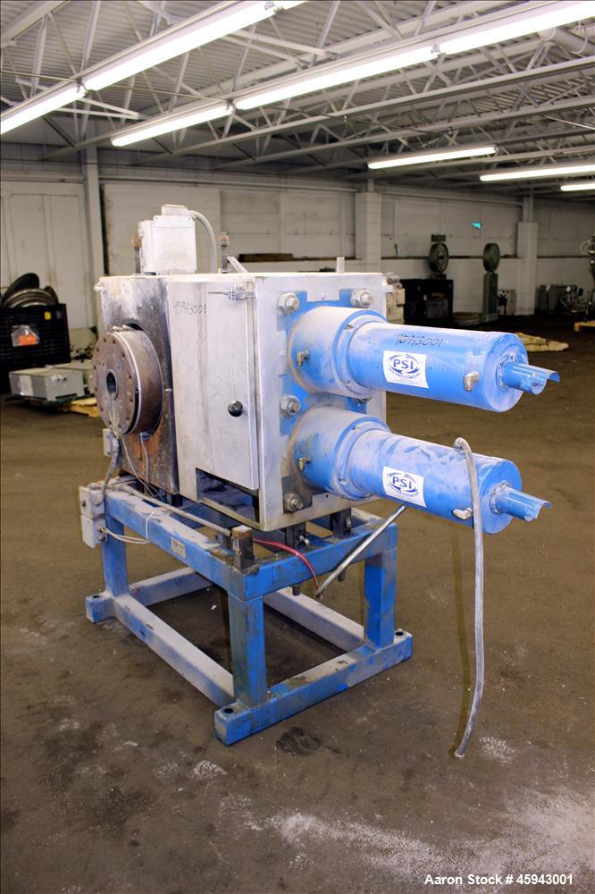 Used PSI Polymer Systems Inc. Continuous Screen Changer, Model CSC-230. Consists of (2) 9" diameter breaker plates with filter cavities. Extruder output 2,250 to 6,000 pounds per hour, 64.53 filter a...