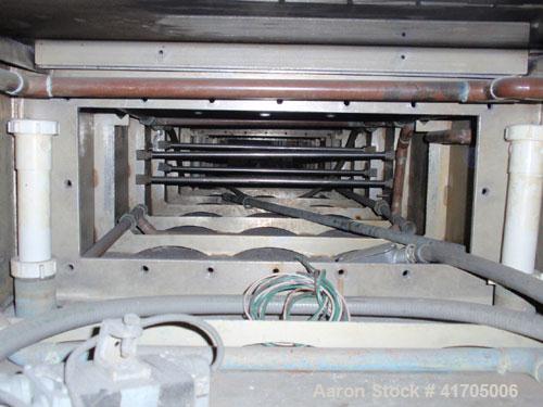 Used Conair Metaplast Vacuum Sizing / Water Tank, model MVS3-14-SPLR, stainless steel. 28" wide x 14" high x 14' long with vacuum pump system, (2) plate heat exchangers and water reservoir.