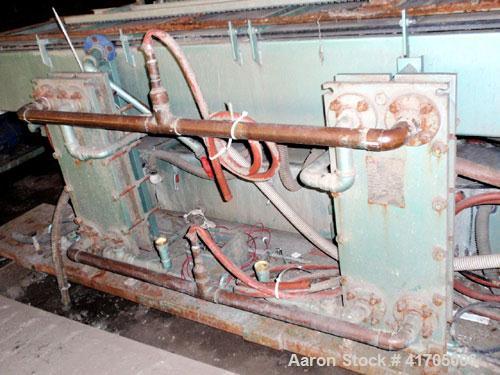 Used Conair Metaplast Vacuum Sizing / Water Tank, model MVS3-14-SPLR, stainless steel. 28" wide x 14" high x 14' long with vacuum pump system, (2) plate heat exchangers and water reservoir.