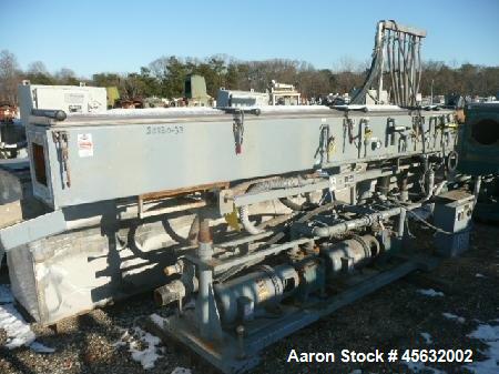 Used Metaplast Vacuum Sizing Tank, Model MVS2-10-4, approximately 10' long. Equipped with (2) pumps. Serial#895009.
