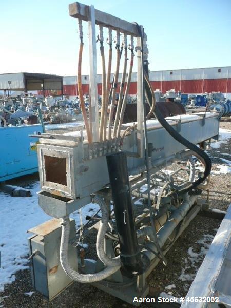 Used Metaplast Vacuum Sizing Tank, Model MVS2-10-4, approximately 10' long. Equipped with (2) pumps. Serial#895009.