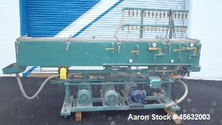 Used Metaplast Vacuum Sizing Tank, Model MVS. Approximately 14' long. Includes (3) pumps.
