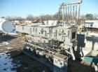 Used Metaplast Vacuum Sizing Tank, Model MVS2-10-4, approximately 10' long. Equipped with (2) pumps. Serial#895009.