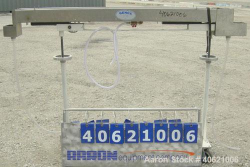 Used Genca Water Bath, stainless steel. 4" wide x 60" long x 3" deep. Mounted on a carbon steel base with casters.