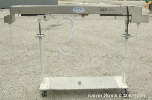 Used Genca Water Bath, stainless steel. 4" wide x 60" long x 3" deep. Mounted on a carbon steel base with casters.