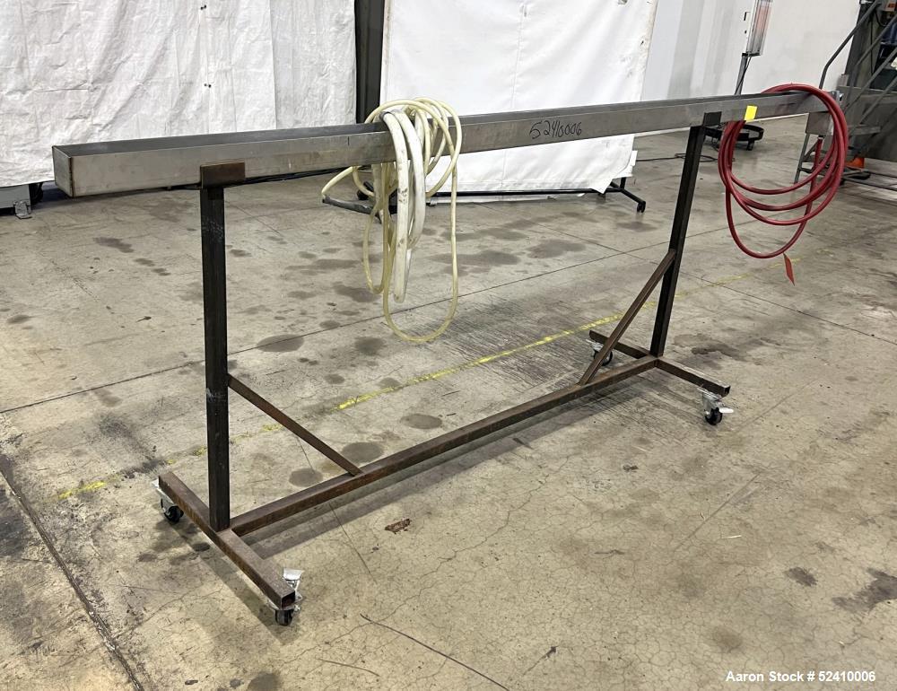 Used Water Bath, 304 Stainless Steel. 4" wide x 120" long x 3" deep trough. 1/2" outlet. Mounted on carbon steel frame with casters.