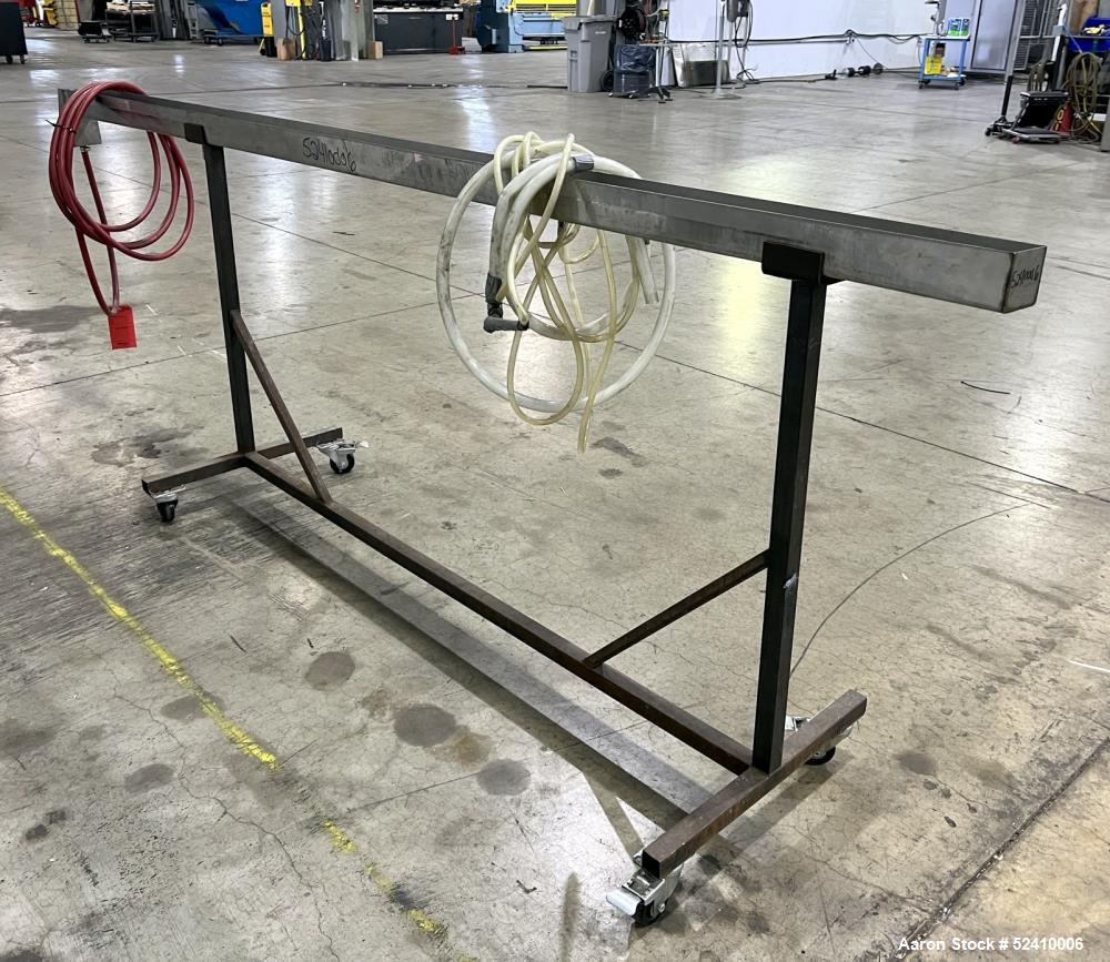Used Water Bath, 304 Stainless Steel. 4" wide x 120" long x 3" deep trough. 1/2" outlet. Mounted on carbon steel frame with casters.