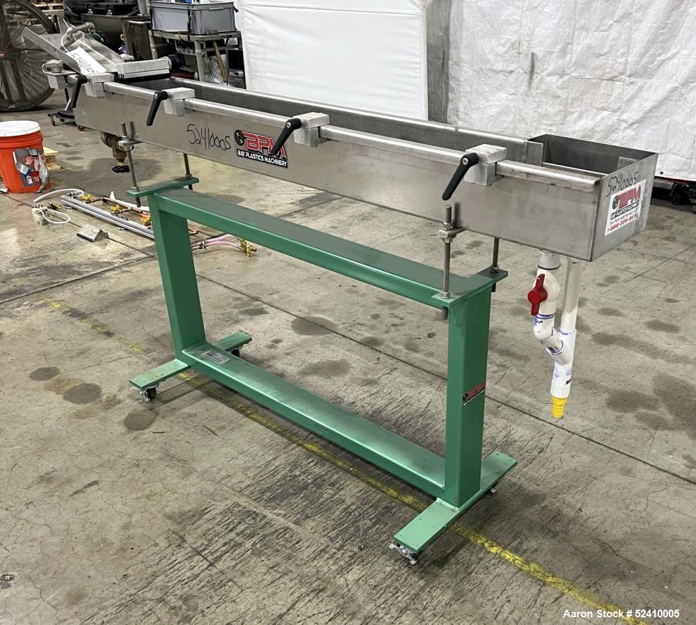 Used BPM Water Bath, Model WBX0606-6, 304 Stainless Steel. 6" wide x 72" long x 6" deep trough. 2" and 1-1/4" outlets fitted with 1" threaded piping. Includes air-knife. Mounted on carbon steel frame...
