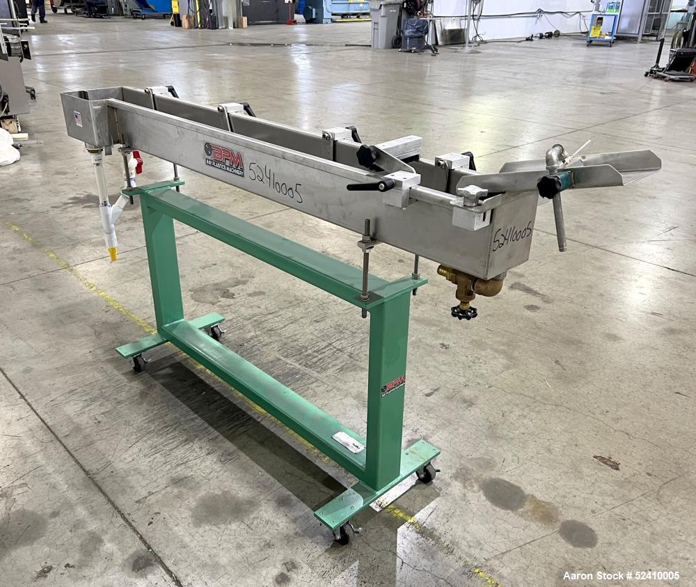 Used BPM Water Bath, Model WBX0606-6, 304 Stainless Steel. 6" wide x 72" long x 6" deep trough. 2" and 1-1/4" outlets fitted with 1" threaded piping. Includes air-knife. Mounted on carbon steel frame...