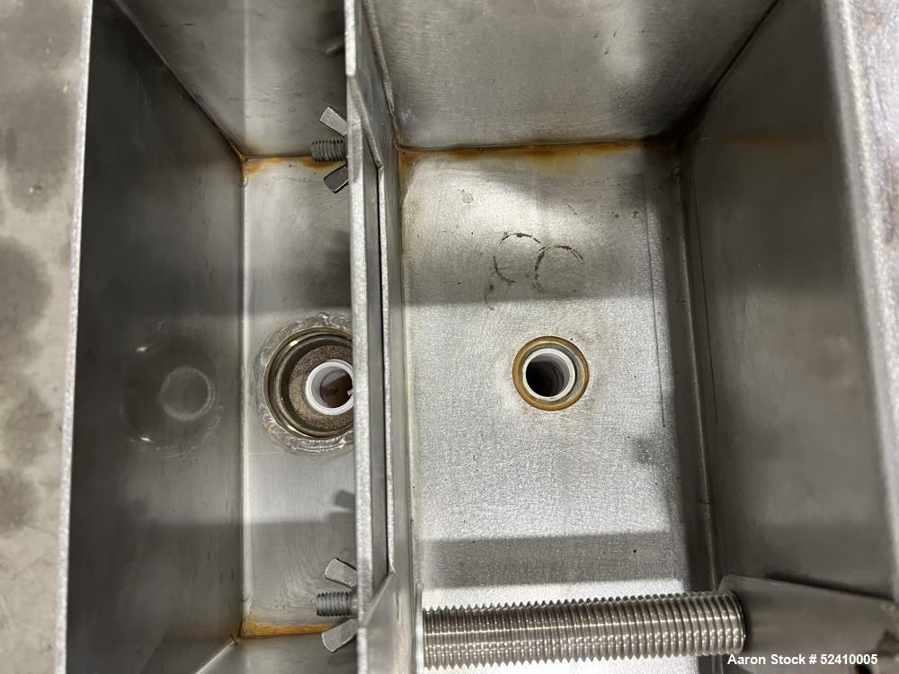 Used BPM Water Bath, Model WBX0606-6, 304 Stainless Steel. 6" wide x 72" long x 6" deep trough. 2" and 1-1/4" outlets fitted with 1" threaded piping. Includes air-knife. Mounted on carbon steel frame...