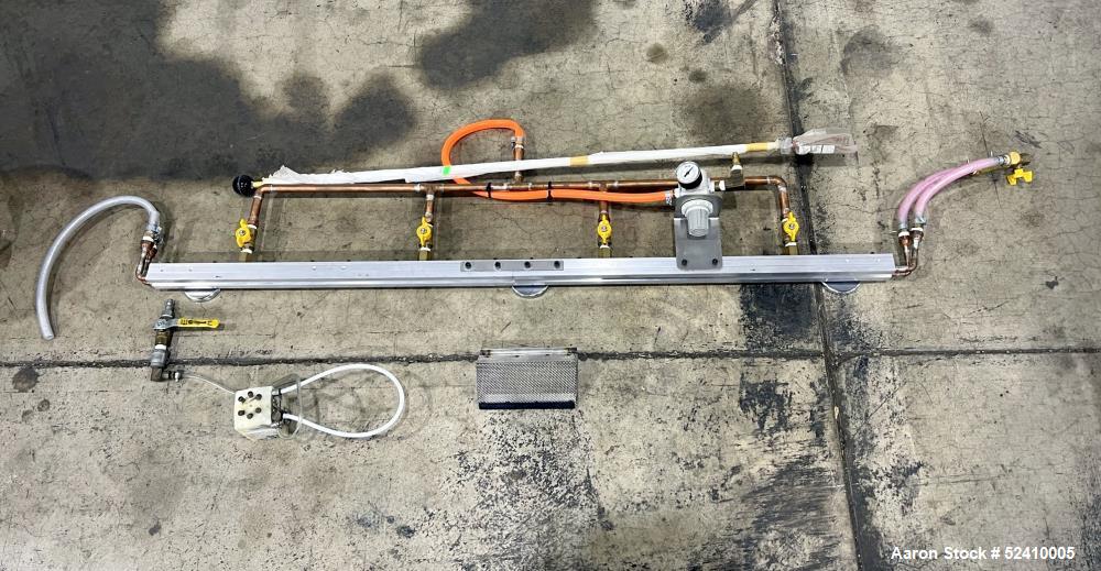 Used BPM Water Bath, Model WBX0606-6, 304 Stainless Steel. 6" wide x 72" long x 6" deep trough. 2" and 1-1/4" outlets fitted with 1" threaded piping. Includes air-knife. Mounted on carbon steel frame...