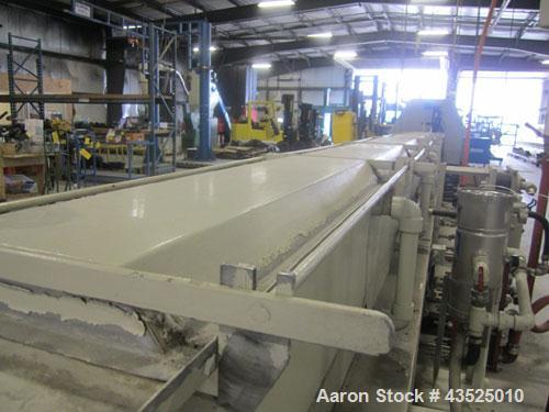 Used CDS Spray Cooling Tank, Model CST12-25, Stainless Steel Construction. 12" x 12" Cross section, 25' long, 8" diameter opening with 2 hp circulation pump, reservoir, water filter, (2) APV plate he...