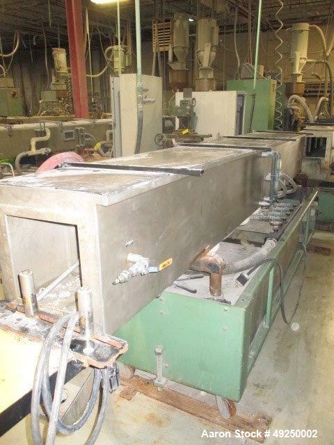 Used Conair Spray Cooling Tank, Model MCB-12-8, Stainless Steel. Approximate 15" x 15" cross section, 12' long. Includes (1) circulating pump. Mounted on a carbon steel frame on casters. Serial# 1803...