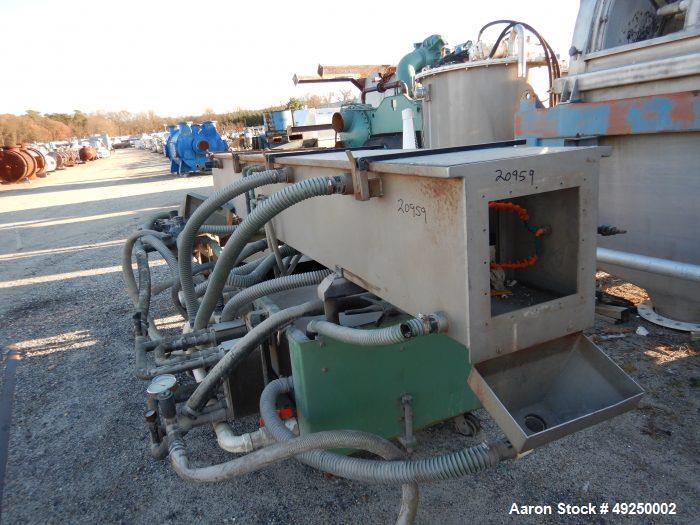 Used Conair Spray Cooling Tank, Model MCB-12-8, Stainless Steel. Approximate 15" x 15" cross section, 12' long. Includes (1) circulating pump. Mounted on a carbon steel frame on casters. Serial# 1803...