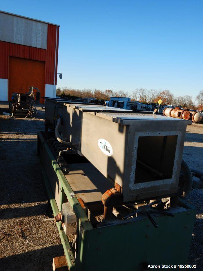 Used Conair Spray Cooling Tank, Model MCB-12-8, Stainless Steel. Approximate 15" x 15" cross section, 12' long. Includes (1) circulating pump. Mounted on a carbon steel frame on casters. Serial# 1803...
