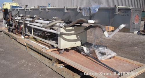 Used Conair Water Cooling Tank, Model MCB-30-4, 304 stainless steel. 12" wide x 360" long x 12" deep. Includes tank, pumps and heat exchanger. Mounted on a carbon steel frame on casters.