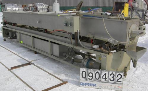 USED: Conair spray cooling tank, model MCB21-8, 304 stainless steel. Approximately (3) sections, 16" wide x 16" deep x 21' long. Includes holding tank, (2) heat exchangers, water pump, vacuum pump an...