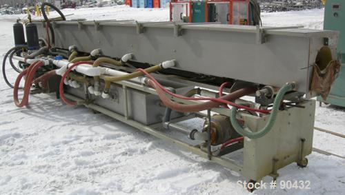 USED: Conair spray cooling tank, model MCB21-8, 304 stainless steel. Approximately (3) sections, 16" wide x 16" deep x 21' long. Includes holding tank, (2) heat exchangers, water pump, vacuum pump an...