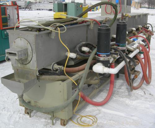 USED: Conair spray cooling tank, model MCB21-8, 304 stainless steel. Approximately (3) sections, 16" wide x 16" deep x 21' long. Includes holding tank, (2) heat exchangers, water pump, vacuum pump an...
