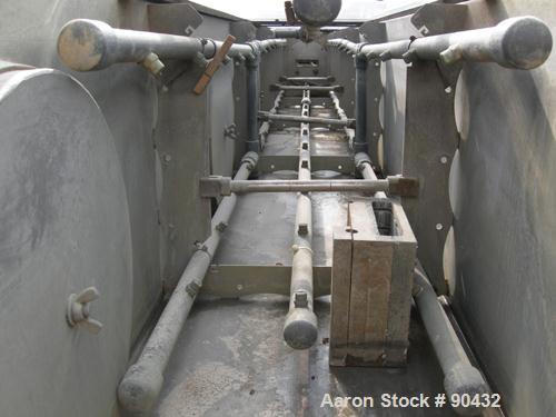 USED: Conair spray cooling tank, model MCB21-8, 304 stainless steel. Approximately (3) sections, 16" wide x 16" deep x 21' long. Includes holding tank, (2) heat exchangers, water pump, vacuum pump an...