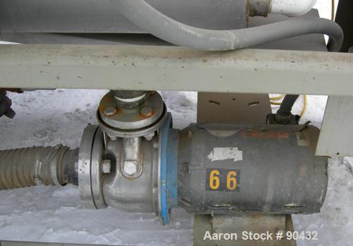 USED: Conair spray cooling tank, model MCB21-8, 304 stainless steel. Approximately (3) sections, 16" wide x 16" deep x 21' long. Includes holding tank, (2) heat exchangers, water pump, vacuum pump an...