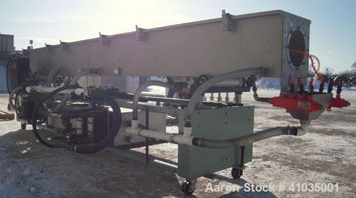 Used Conair Spray Cooling Tank, Model WCB-16-8, 304 Stainless Steel. 16" wide x 192" long x 16" deep. 3 piece top cover, (4) spray pipes with nozzles. Includes a pump and holding tank. Mounted on a c...