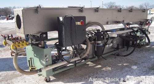Used Conair Spray Cooling Tank, Model WCB-16-8, 304 Stainless Steel. 16" wide x 192" long x 16" deep. 3 piece top cover, (4) spray pipes with nozzles. Includes a pump and holding tank. Mounted on a c...