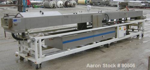 Used: Extrusion Services Inc.(ESI) spray cooling tank, 304 stainless steel. 26" wide x 11" deep x 21' long.(3) sections of 4' long covers. Includes holding tank,(2) pumps, filter, heat exchanger, vac...