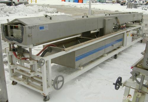 Used: Extrusion Services Inc (ESI) Spray Cooling Tank, 304 stainless steel. 26" wide x 11" deep x 20'4" long. (3) sections of 4' long covers. Includes holding tank, pump, filter, heat exchanger and c...