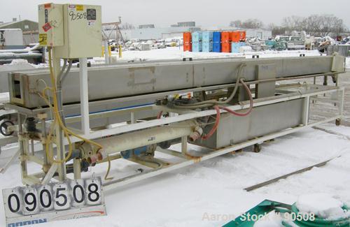 Used: Extrusion Services Inc.(ESI) spray cooling tank,304 stainless steel. 16" wide x 11" deep x 20' long.(4) section top cover. Includes holding tank,pump, heat exchanger,and control panel. Mounted ...