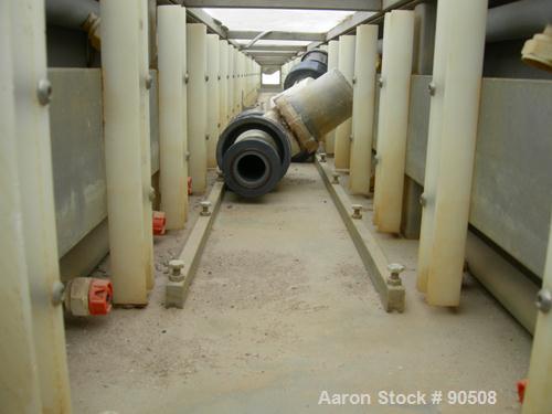 Used: Extrusion Services Inc.(ESI) spray cooling tank,304 stainless steel. 16" wide x 11" deep x 20' long.(4) section top cover. Includes holding tank,pump, heat exchanger,and control panel. Mounted ...