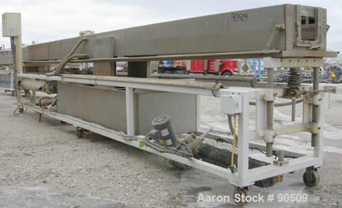 Used: Extrusion Services Inc (ESI) spray cooling tank, 304 stainless steel. 16" wide x 11" deep x 20' long. (4) section top cover. Includes holding tank, pump, heat exchanger and control panel. Mount...
