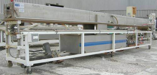 Used: Extrusion Services Inc (ESI) spray cooling tank, 304 stainless steel. 16" wide x 11" deep x 20' long. (4) section top cover. Includes holding tank, pump, heat exchanger and control panel. Mount...