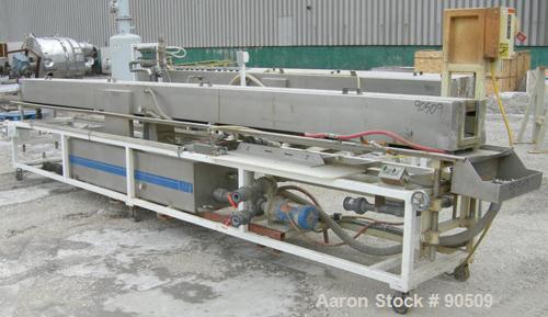 Used: Extrusion Services Inc (ESI) spray cooling tank, 304 stainless steel. 16" wide x 11" deep x 20' long. (4) section top cover. Includes holding tank, pump, heat exchanger and control panel. Mount...