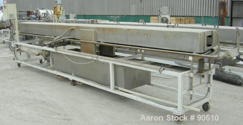 Used: Extrusion Services Inc (ESI) spray cooling tank, 304 stainless steel. 16" wide x 11" deep x 20' long. (4) section top cover. Includes holding tank ,pump, heat exchanger and control panel. Mount...