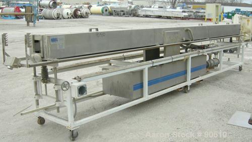 Used: Extrusion Services Inc (ESI) spray cooling tank, 304 stainless steel. 16" wide x 11" deep x 20' long. (4) section top cover. Includes holding tank ,pump, heat exchanger and control panel. Mount...