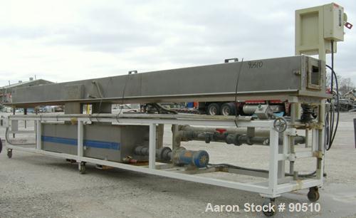 Used: Extrusion Services Inc (ESI) spray cooling tank, 304 stainless steel. 16" wide x 11" deep x 20' long. (4) section top cover. Includes holding tank ,pump, heat exchanger and control panel. Mount...