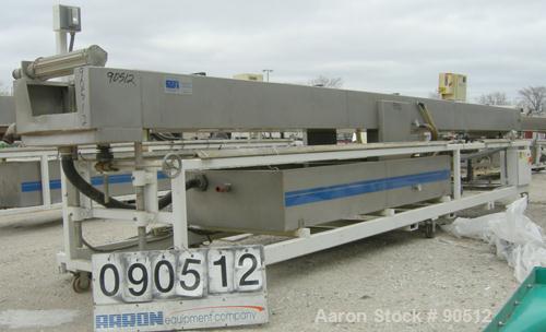 Used: Extrusion Services Inc (ESI) spray cooling tank, 304 stainless steel. 26" wide x 11" deep x 21'6" long. (5) section top cover. Includes holding tank, pump, heat exchanger and control panel. Mou...