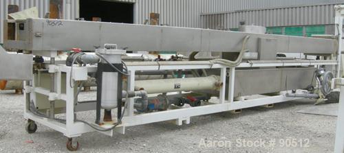 Used: Extrusion Services Inc (ESI) spray cooling tank, 304 stainless steel. 26" wide x 11" deep x 21'6" long. (5) section top cover. Includes holding tank, pump, heat exchanger and control panel. Mou...