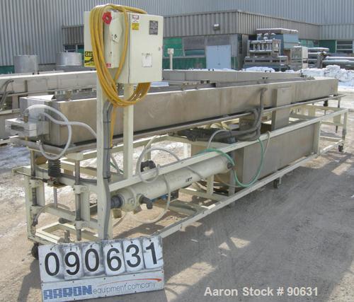 Used: Extrusion Services Inc.(ESI) spray cooling tank, 304 stainless steel. 16" wide x 11" deep x 20' long.(4) section top cover. Includes holding tank,pump, heat exchanger,and control panel. Mounted...