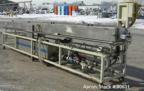 Used: Extrusion Services Inc.(ESI) spray cooling tank, 304 stainless steel. 16" wide x 11" deep x 20' long.(4) section top cover. Includes holding tank,pump, heat exchanger,and control panel. Mounted...