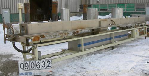 Used: Extrusion Services Inc.(ESI) spray cooling tank, 304 stainless steel. 16" wide x 11" deep x 25' long.(5) section top cover. Includes holding tank,pump, heat exchanger,and control panel. Mounted...