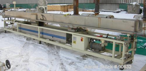 Used: Extrusion Services Inc.(ESI) spray cooling tank, 304 stainless steel. 16" wide x 11" deep x 25' long.(5) section top cover. Includes holding tank,pump, heat exchanger,and control panel. Mounted...