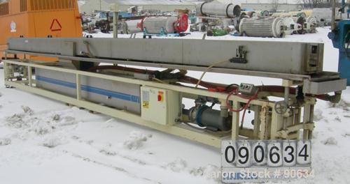 Used: Extrusion Services Inc.(ESI) spray cooling tank, 304 stainless steel. 16" wide x 11" deep x 25' long.(4) section top cover (1) missing. Includes holding tank,pump, heat exchanger,and control pa...