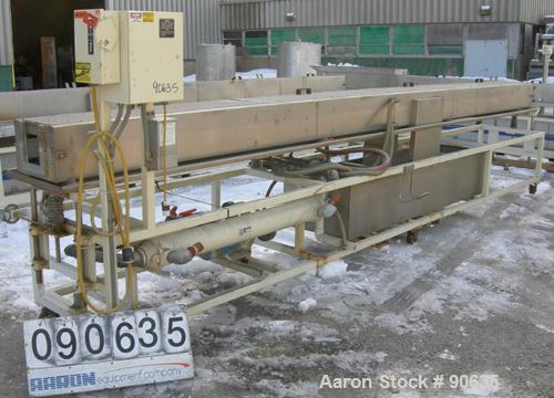 Used: Extrusion Services Inc.(ESI) spray cooling tank, 304 stainless steel. 16" wide x 11" deep x 20' long.(4) section top cover. Includes holding tank,pump, heat exchanger,and control panel. Mounted...