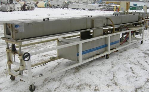 Used: Extrusion Services Inc.(ESI) spray cooling tank, 304 stainless steel. 16" wide x 11" deep x 20' long.(4) section top cover. Includes holding tank,pump, heat exchanger,and control panel. Mounted...